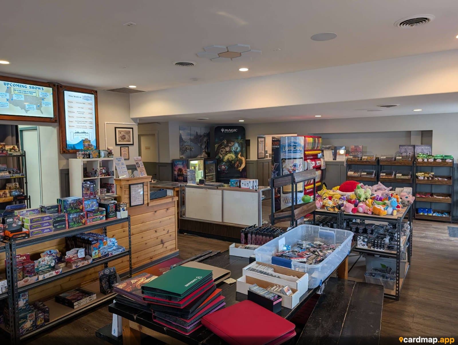 Retail floor and card-game merchandise inside Journey's End Games